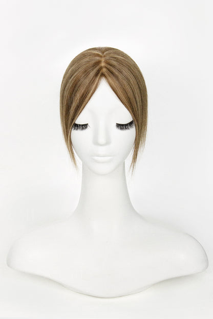 Mannequin head with a Hera Human Hair Topper Medium Brown with Warm Highlights 