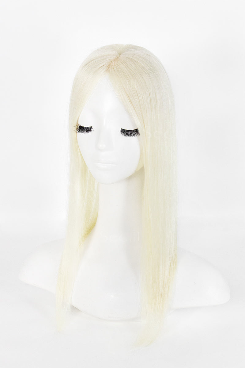 A long, straight platinum blonde wig displayed on a white mannequin head against a clean white background.
