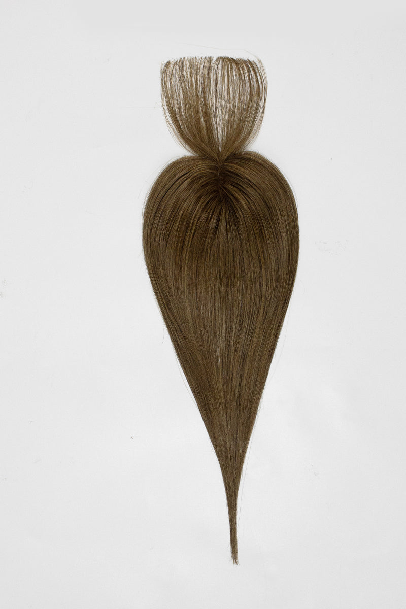 Brown hair topper styled in a ponytail on a white background