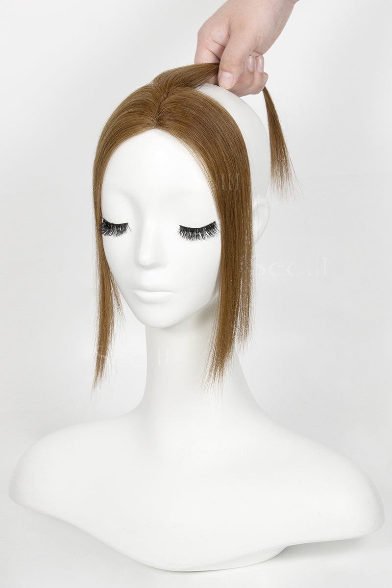 Mannequin head with a Magic Pixie Topper Light Auburn Brown 