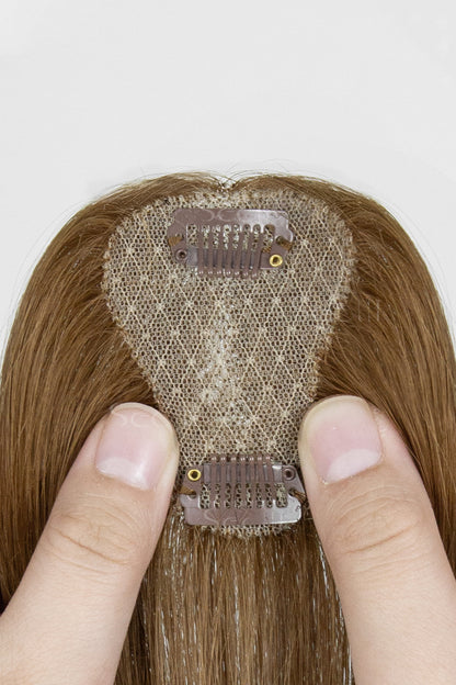 Close-up of a hairpiece with a person&