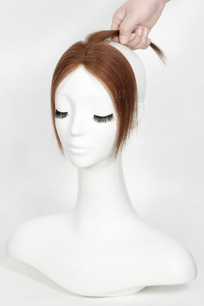 Mannequin head with a Magic Pixie Topper Dark Auburn Brown 