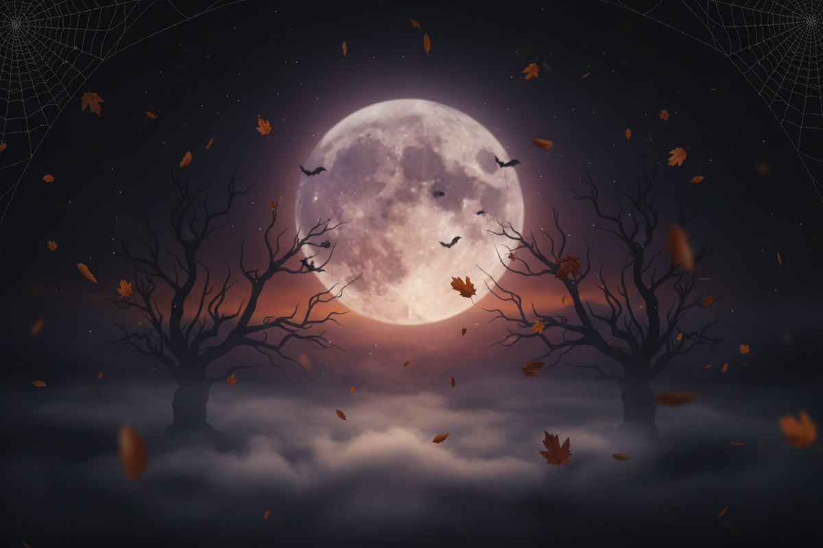 Halloween night scene with a large glowing full moon over dark bare trees, falling orange leaves, silhouetted bats, and misty clouds below.