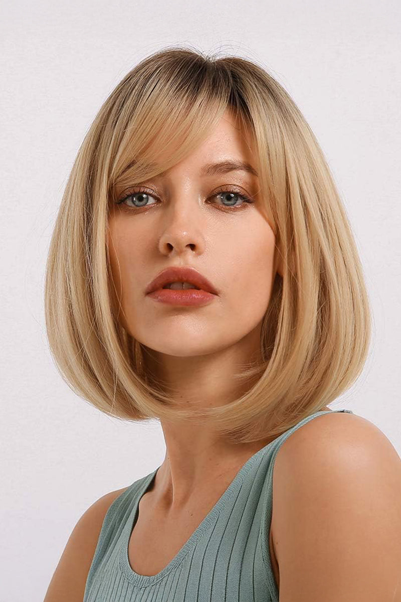 A blonde bob wig with straight-cut bangs, modeled on a woman against a plain light gray background.