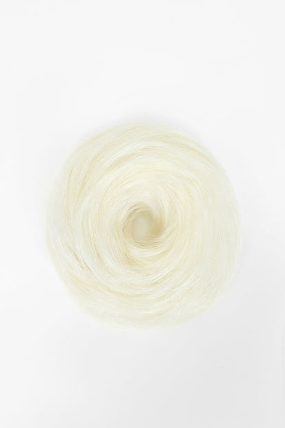White blonde hair scrunchie arranged in a circular bun shape on a white background.